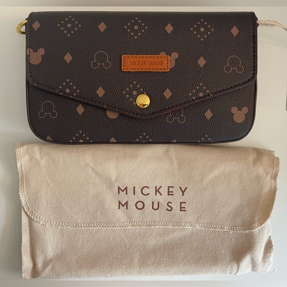 Brand new with tag on. 2 Disney Mickeythree-in-one bags. Brown&orange color
